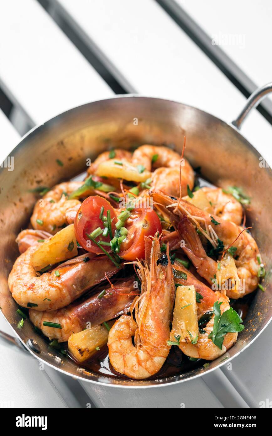 spicy sauteed asian stir fry king prawns with pineapple in singapore