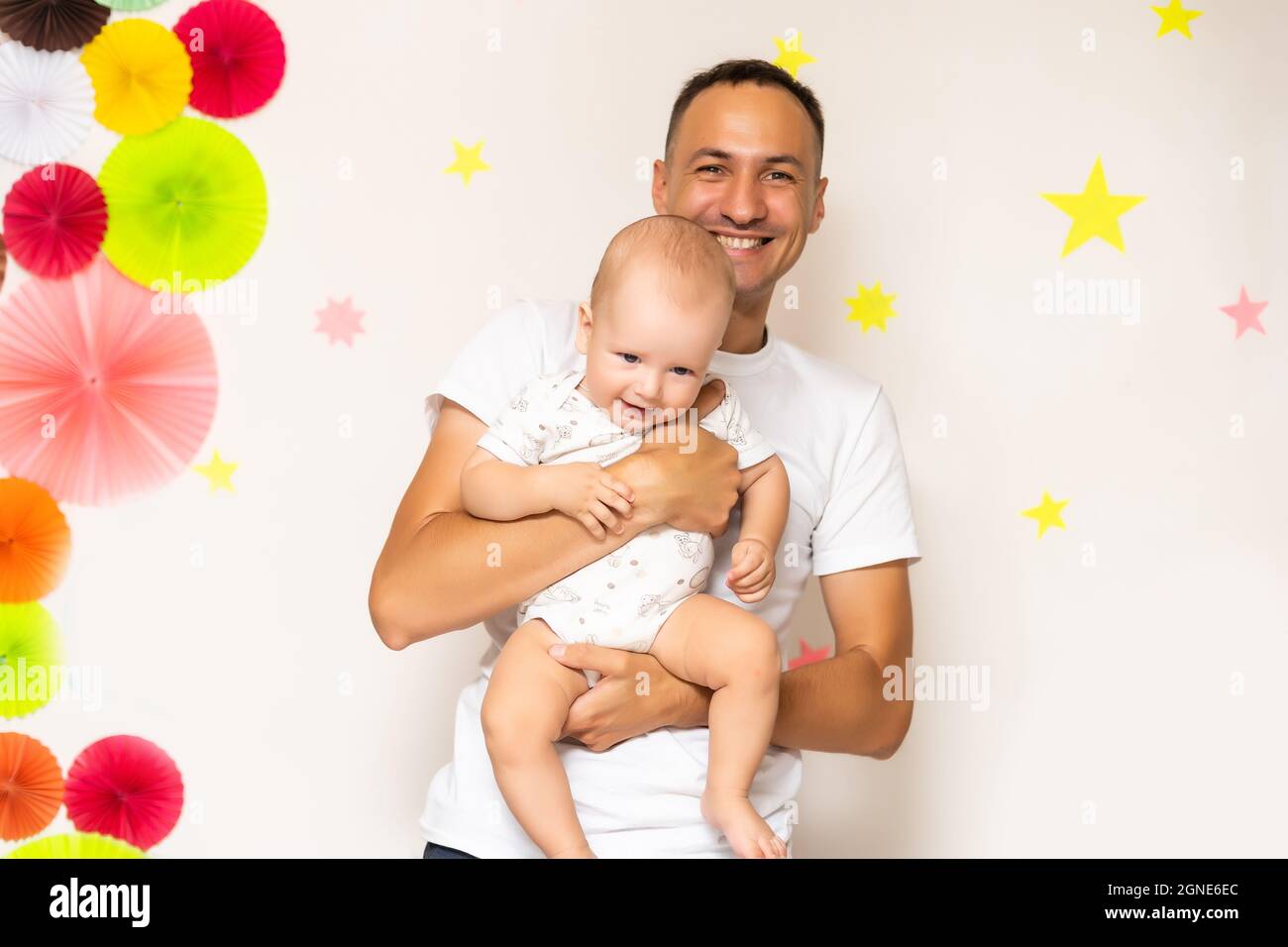 Man cradling baby daughter in his arms hires stock photography and images Alamy