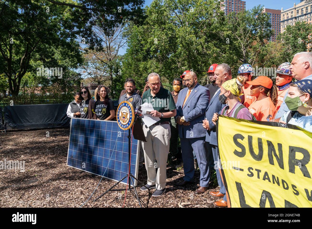 New York, USA. 24th Sep, 2021. U. S. Senator Schumer, Labor, and Climate Activists call for Civilian Conservation Corps funding from Congress at Battery Urban Farm. Their announcement came on a day when climate strikes were held around the world to bring attention of people and businesses to climate crisis. Schumer was joined by labor leaders District Concil 37 Executive Director Henry Carrido, President of Building and Construction Trades Council of Greater New York Gary LaBarbera, union members, activists from Sunrise Movement and service members of Green City Task Force. Schumer said the Ci Stock Photo