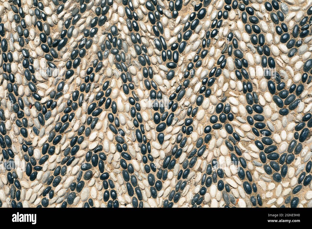 Pattern of uneven stones arranged as a triangle Stock Photo