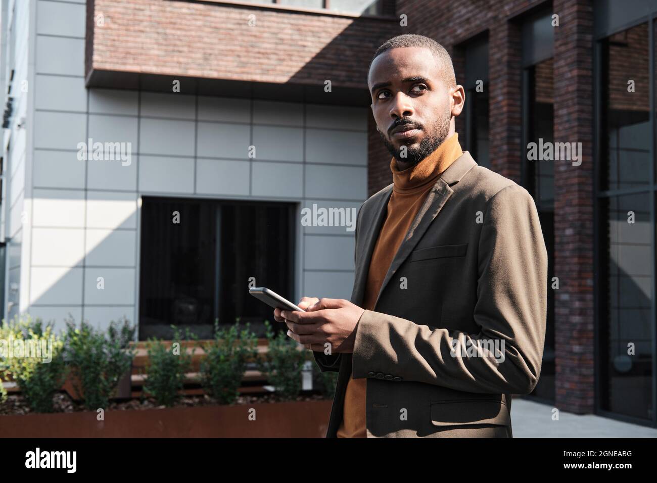 A man with a goatee and a turtle neck sweater photo – Man face