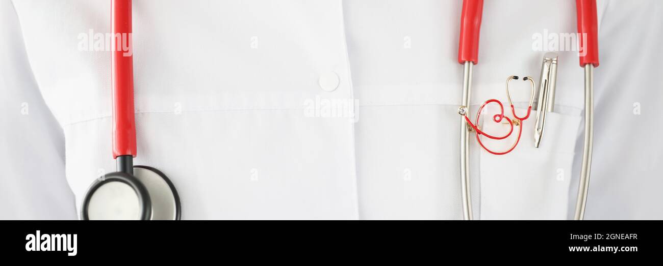 Red stethoscope hanging on doctor neck closeup Stock Photo Alamy
