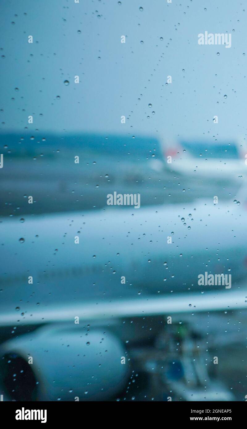 Rain Drops On Clean Airport Terminal Building Window With Defocused Airplanes At Background Apron In Gloomy Day Stock Photo Alamy