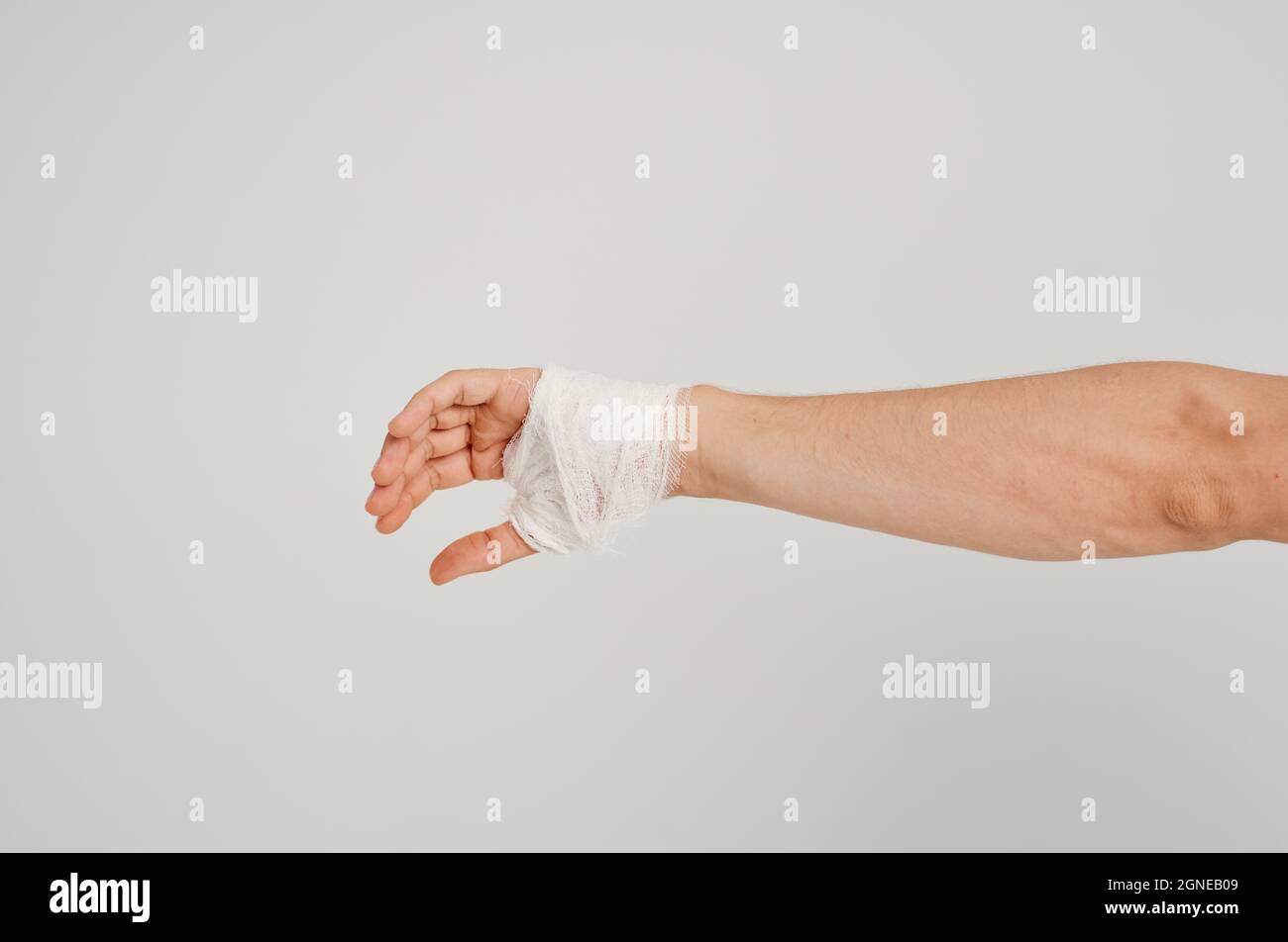 male patient bandaged hand injury to fingers hospitalization light