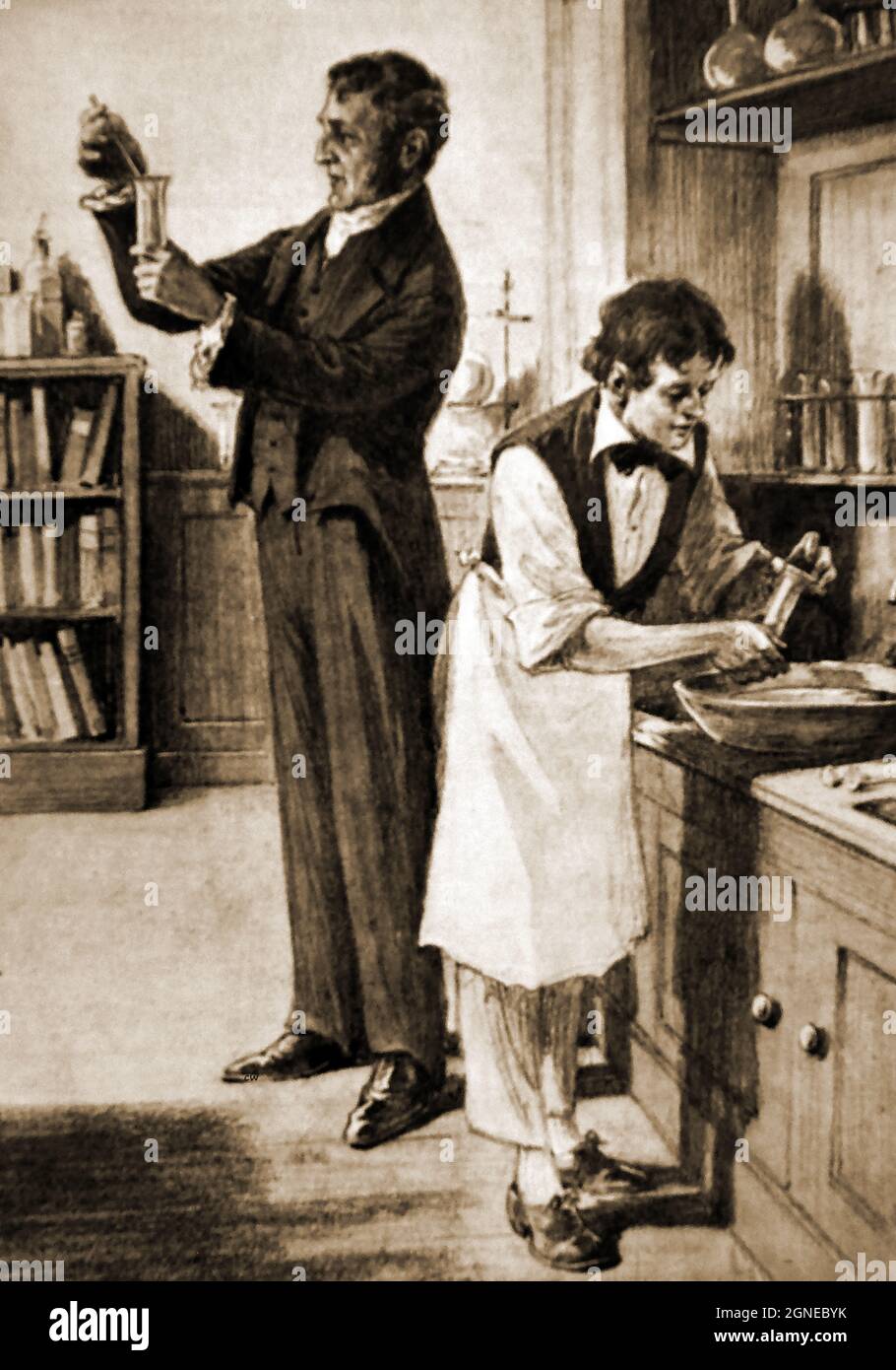 1930's image of the inside of the laboratory  of Sir Humphry Davy (1778 – 1829) showing Davy and a young Michael Faraday (1791 –  1867) working for him. Faraday  was a scientist who contributed to the study of magnetism and electrochemistry working with  electromagnetic induction, diamagnetism and electrolysis. Davy invented the Davy Lamp an an early form of arc lamp. Stock Photo
