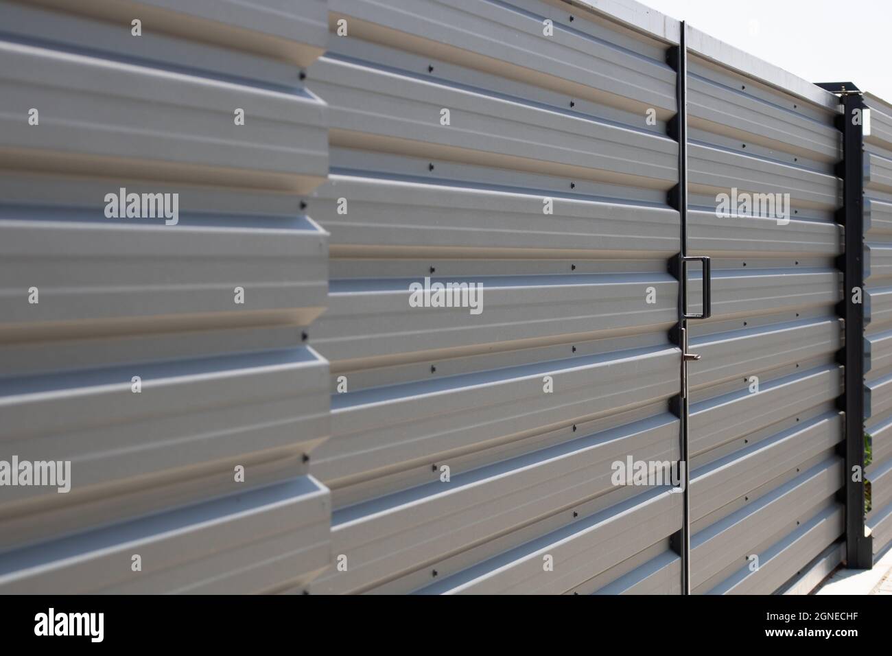 Close up of corrugated metal fence,  horizontal modern metal fence Stock Photo