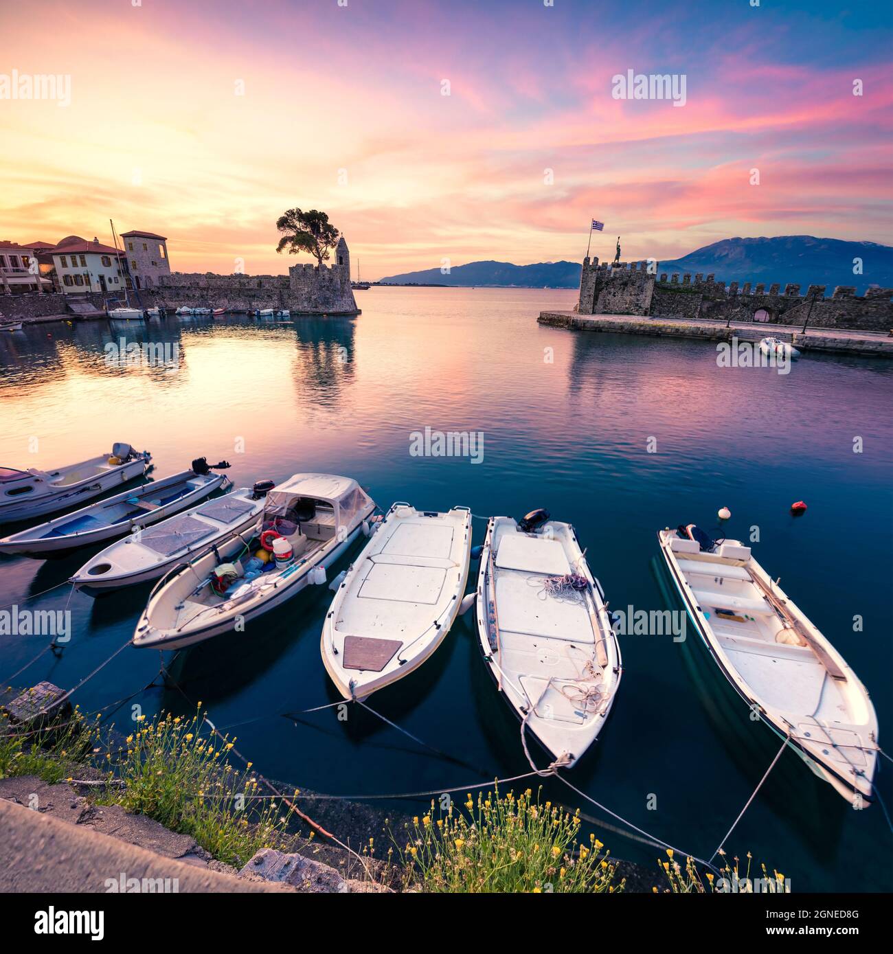 Impressive spring view of the Nafpaktos port. Fantastic sunrise in the Gulf of Corinth, Greece, Europe. Beauty of countryside concept background. Beau Stock Photo