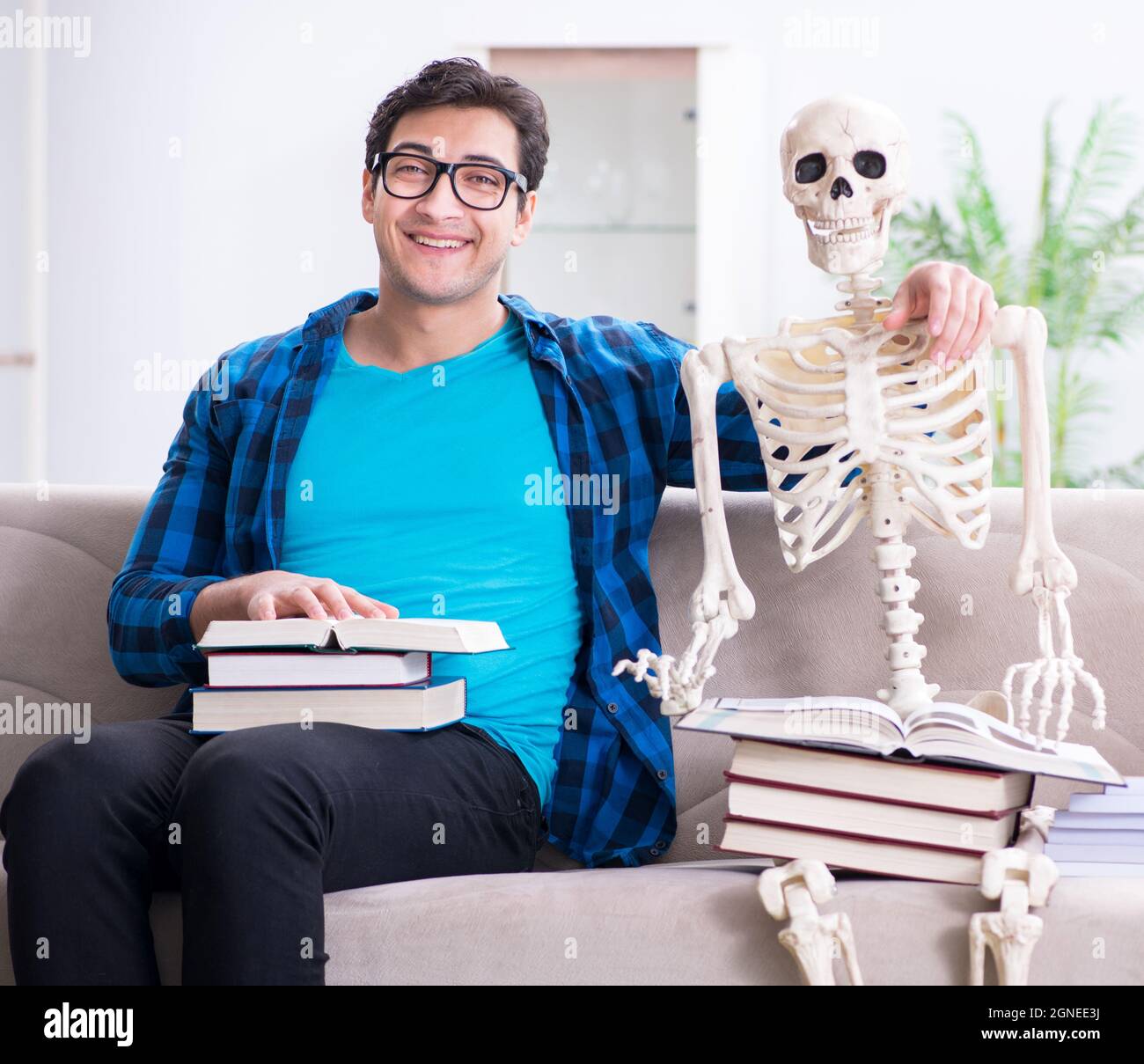 The student studying with skeleton preparing for exams Stock Photo