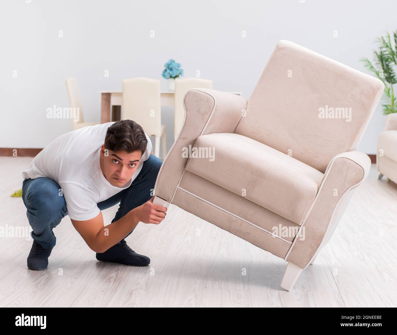 The man moving furniture at home Stock Photo Alamy
