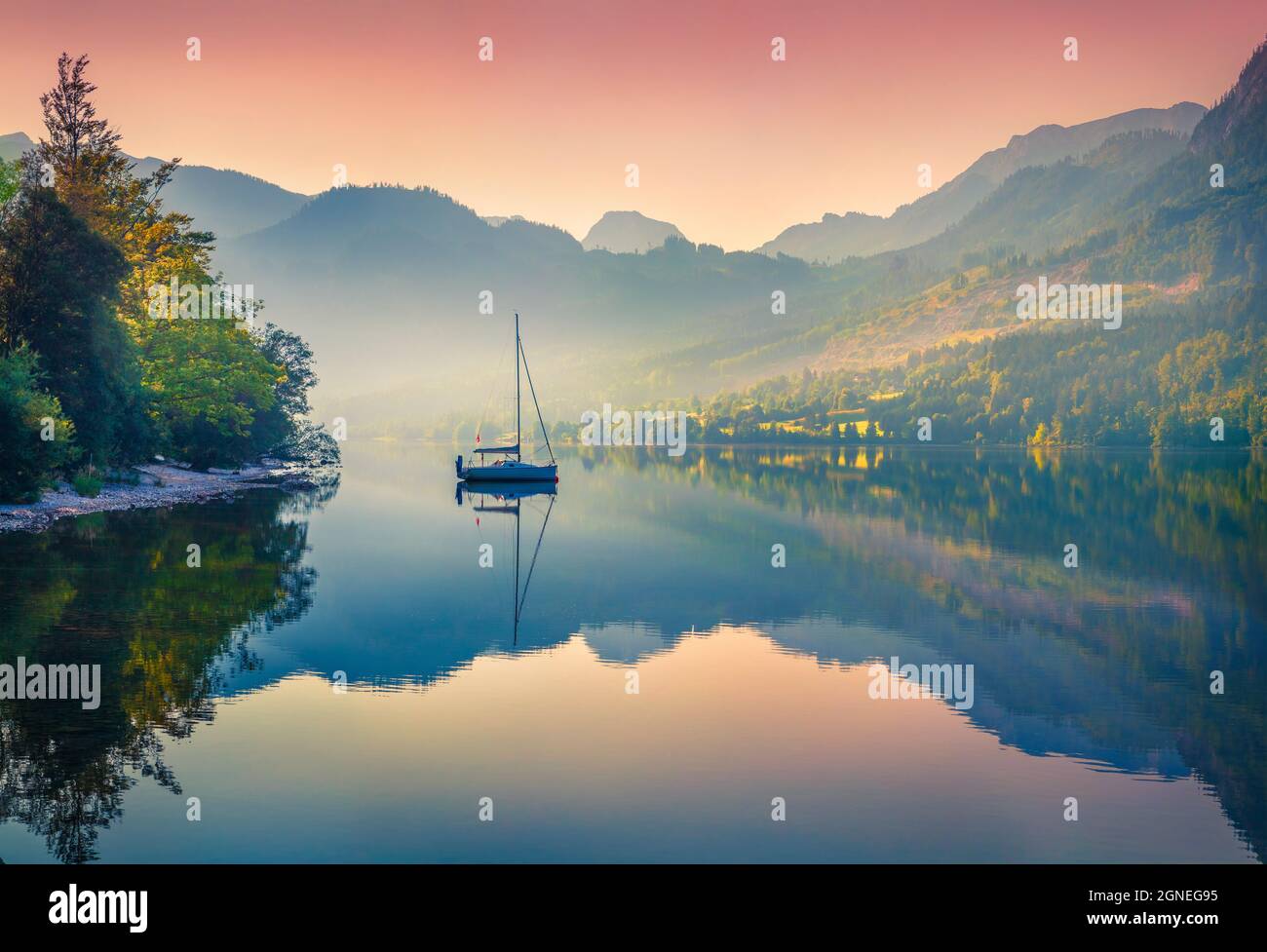 Impressive sunrise of Grundlsee lake. Beautiful summer view of Gessl village, Liezen District of Styria, Austria, Alps. Europe. Beauty of countryside Stock Photo