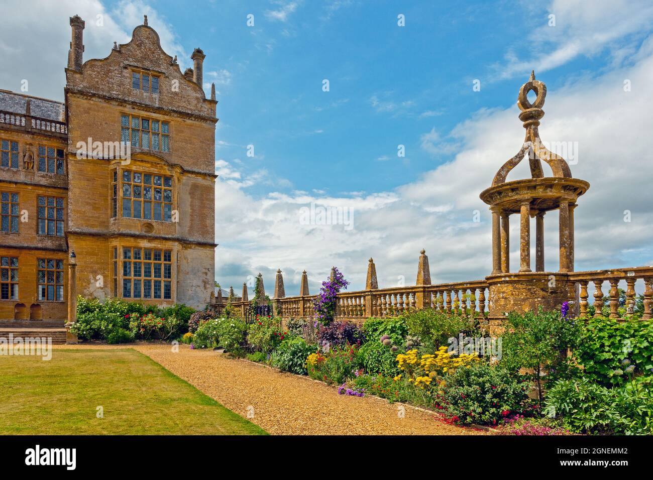 A colourful border next to the east lawn and east front at Montacute House, an Elizabethan mansion with garden near Yeovil, Somerset, England, UK Stock Photo