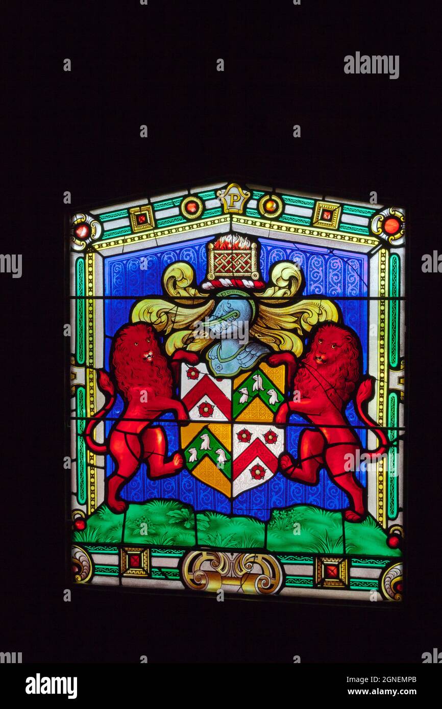 A stained glass window of the Phelips family coast of arms in Montacute House, an Elizabethan mansion with garden near Yeovil, Somerset, England, UK Stock Photo