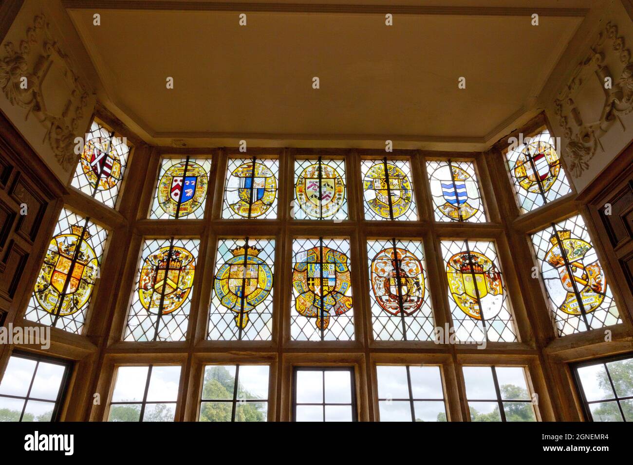 Historic stained glass of family coats of arms in the Great Chamber in Montacute House, an Elizabethan mansion nr Yeovil, Somerset, England, UK Stock Photo
