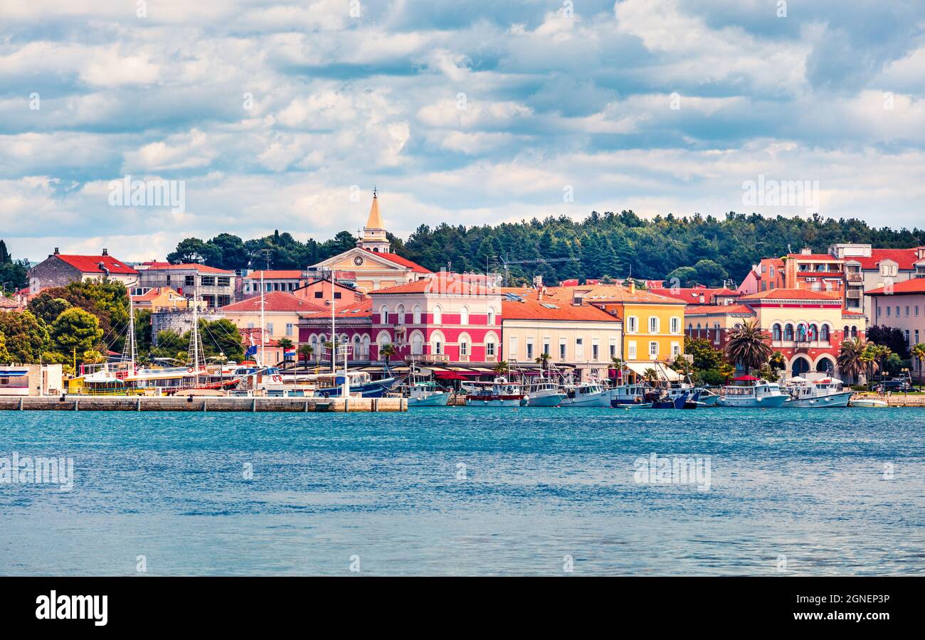 Splendid morning cityscape of popular summer resort Porec. Colorful spring seascape of Adriatic Sea. Wonderful scene of Istrian Peninsula in western C Stock Photo