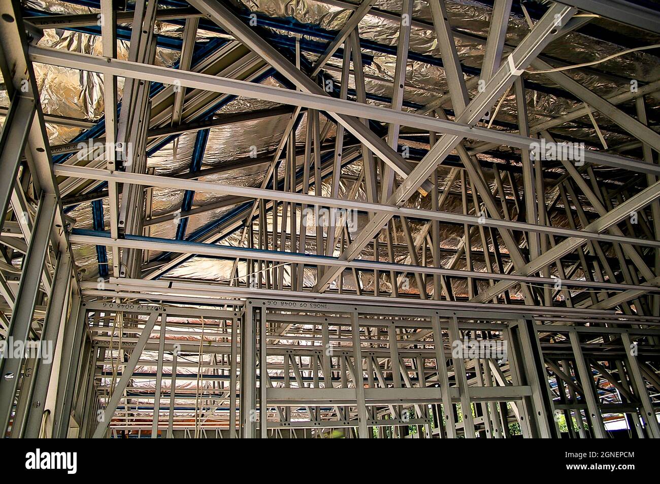 Steel frame construction for a new house build. Interior view showing insulation blanket over roof.  Queensland, Australia, 2006. Stock Photo