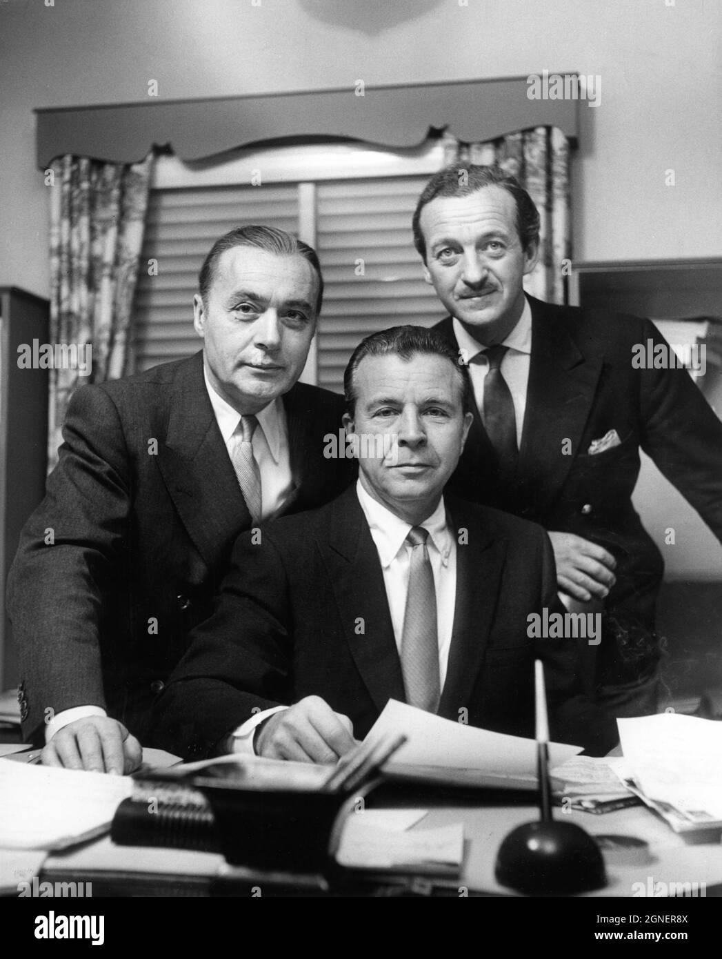 CHARLES BOYER DICK POWELL and DAVID NIVEN 1955 publicity Portrait as Directors of FOUR STAR PRODUCTIONS (later FOUR STAR TELEVISION ) the prolific Television Production Company they founded in 1952 Stock Photo