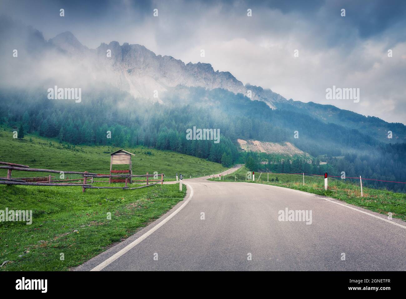 Dramatic summer view of Cresta di Enghe mountain range. Misty morning view of Dolomite Alps, Italy, Europe. Beauty of nature concept background. Orton Stock Photo