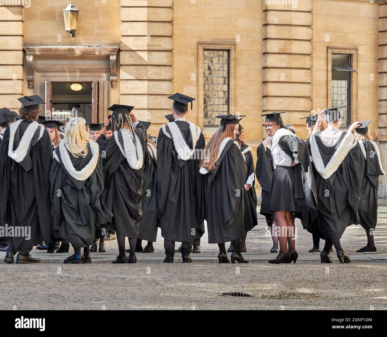 Graduate students of the university of Oxford, England, line up in the