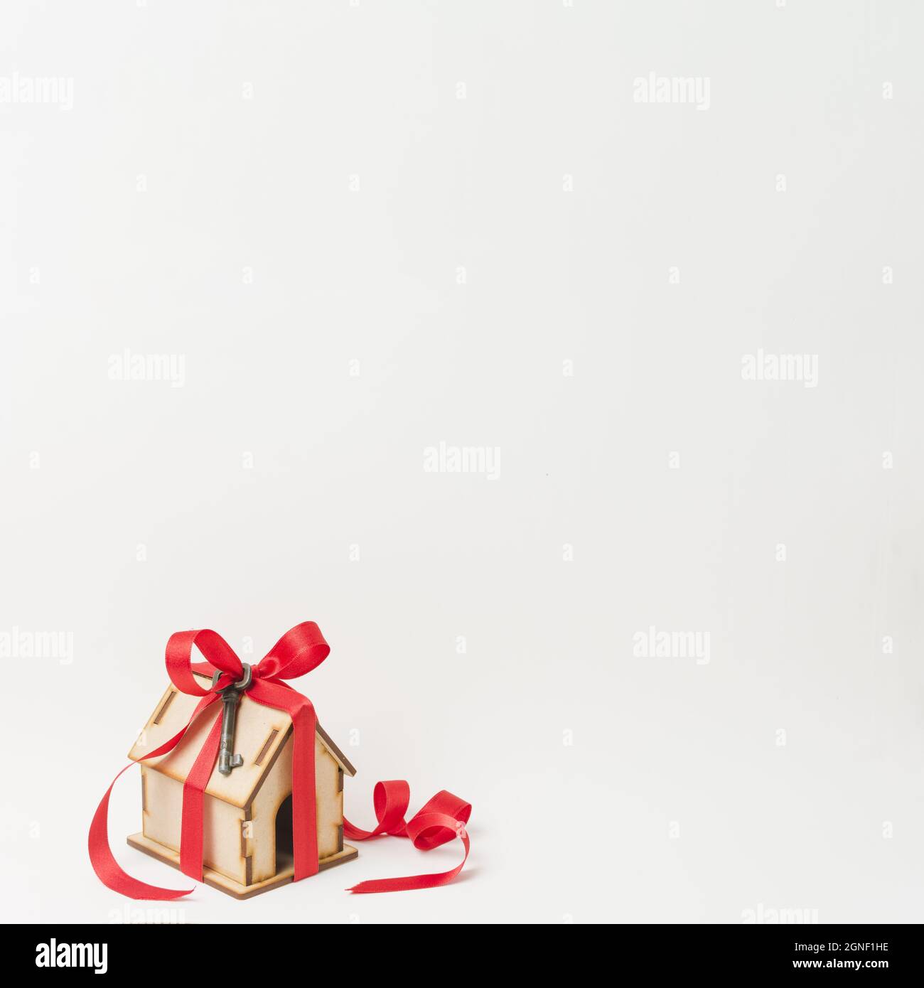 house model metallic key tied by red ribbon with space text. High ...
