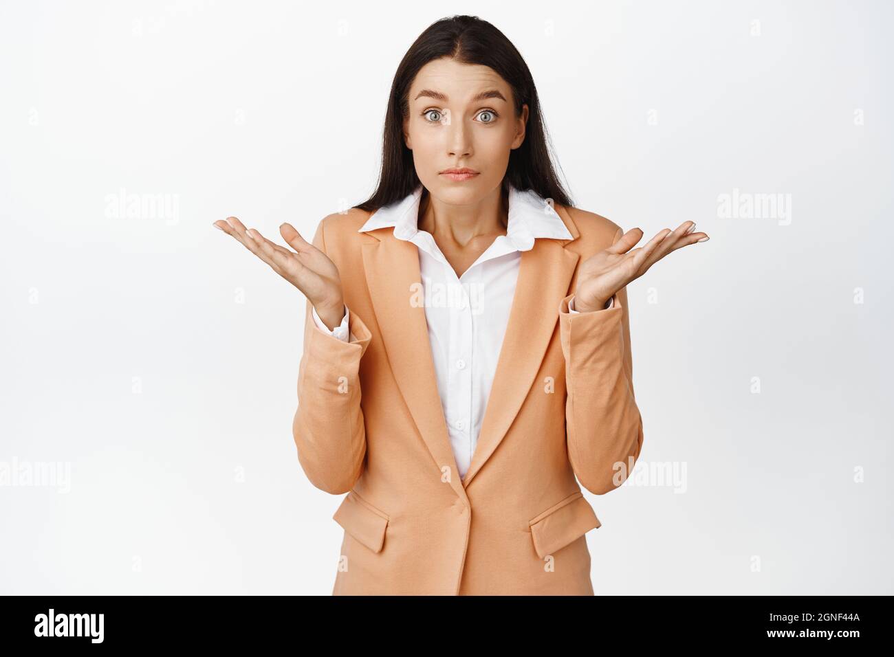 Oops sorry. Confused business woman shrugging with apologatic look