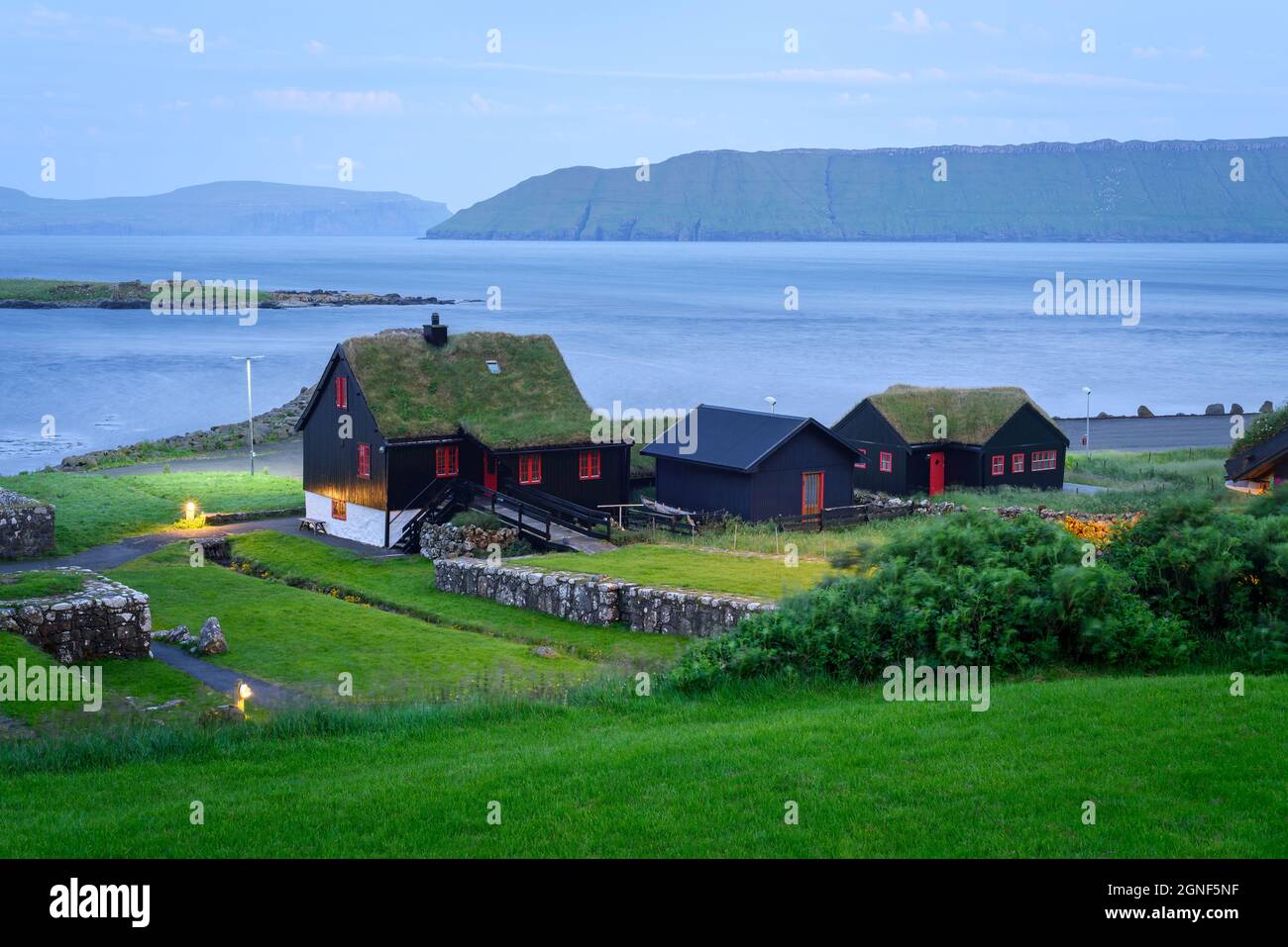 Kirkjubour village on Streymoy and has a view the islands of Sandoy and Hestur, Faroe Islands Stock Photo