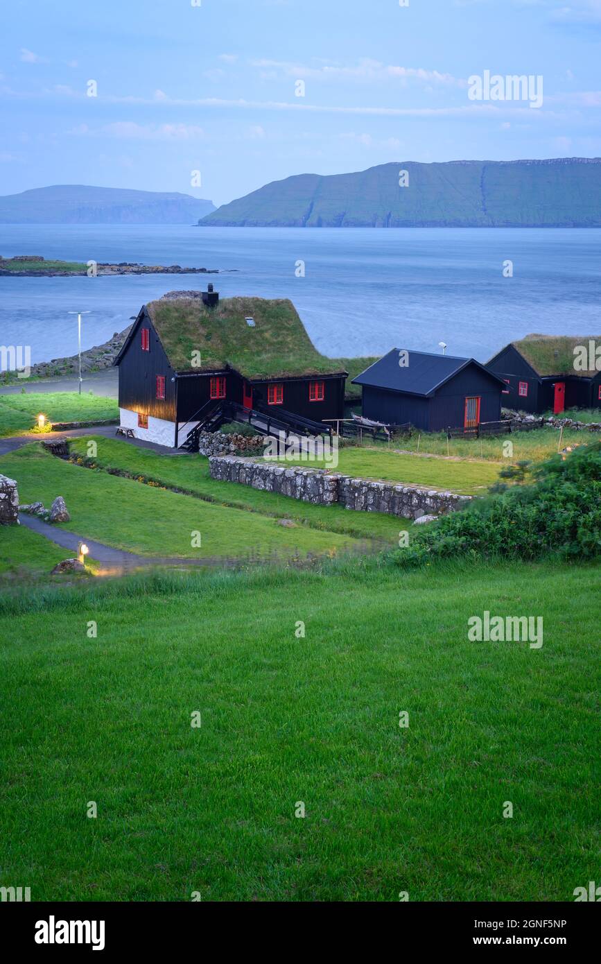 Old farmhouse of Kirkjuboargardur with turf roof in Kirkjubour village on Streymoy, Faroe Islands Stock Photo
