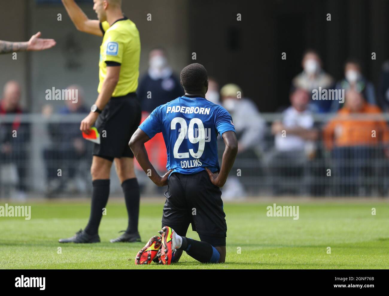 Paderborn, Germany. 25th Sep, 2021. Football: 2. Bundesliga, SC Paderborn 07 - Holstein Kiel, Matchday 8 at Benteler-Arena. Paderborn's Jamilu Collins is disappointed after receiving a yellow card. Credit: Friso Gentsch/dpa - IMPORTANT NOTE: In accordance with the regulations of the DFL Deutsche Fußball Liga and/or the DFB Deutscher Fußball-Bund, it is prohibited to use or have used photographs taken in the stadium and/or of the match in the form of sequence pictures and/or video-like photo series./dpa/Alamy Live News Stock Photo