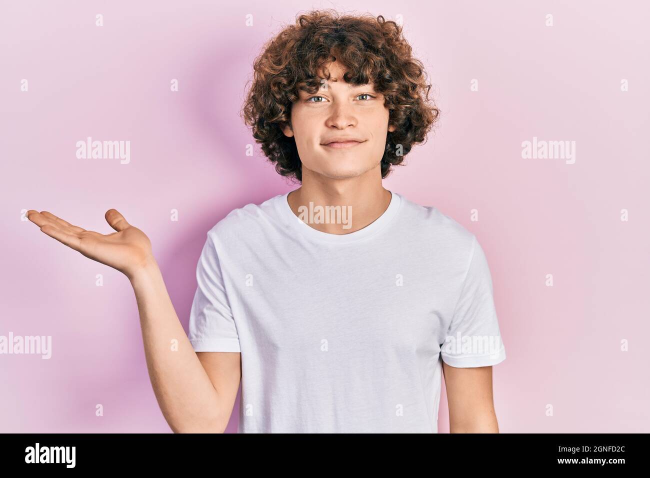 Handsome young man wearing casual white t shirt smiling cheerful ...