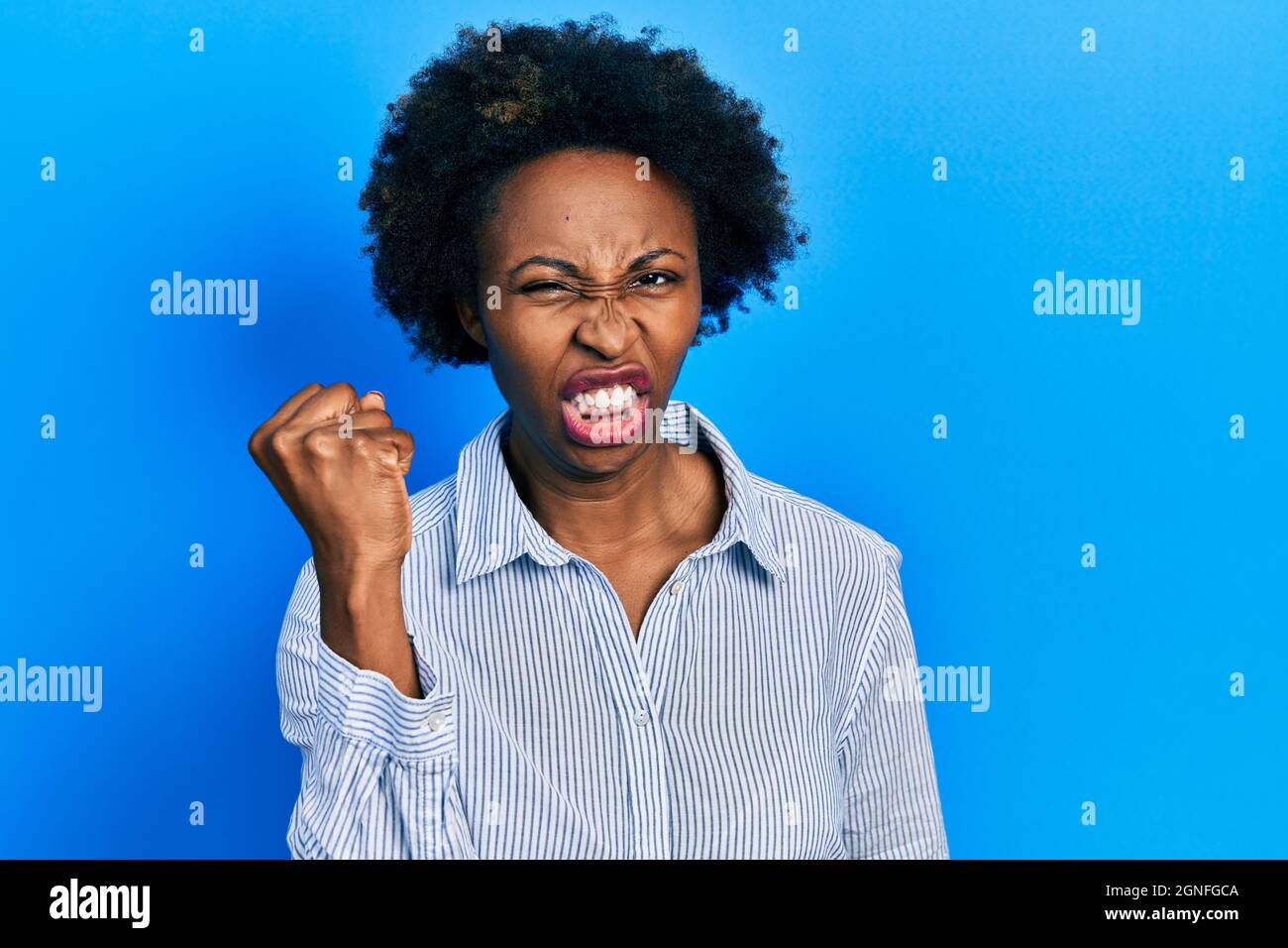 Young african american woman wearing casual clothes angry and mad ...