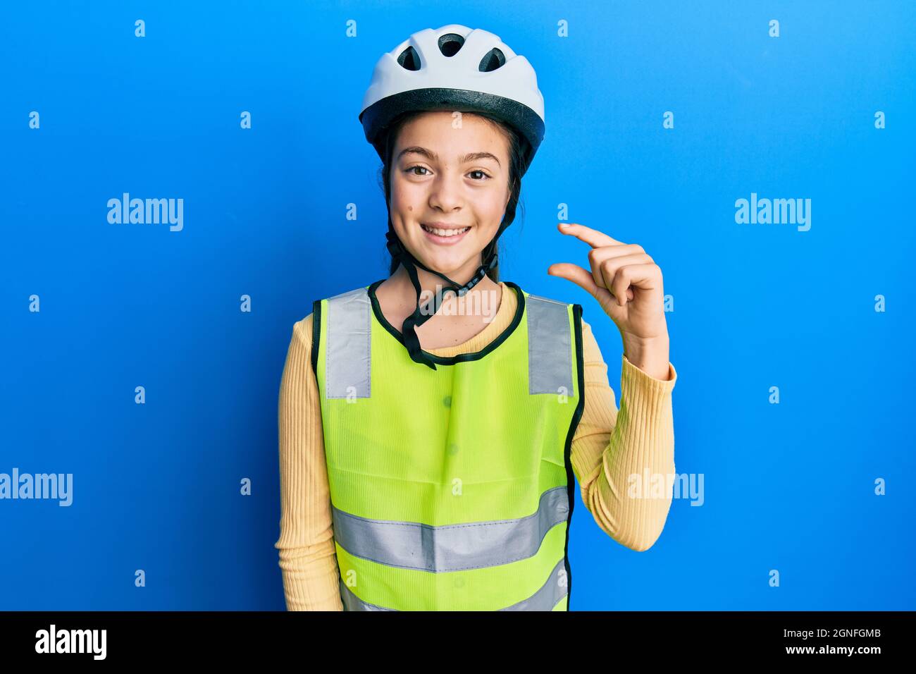wearing bike helmet and reflective vest 