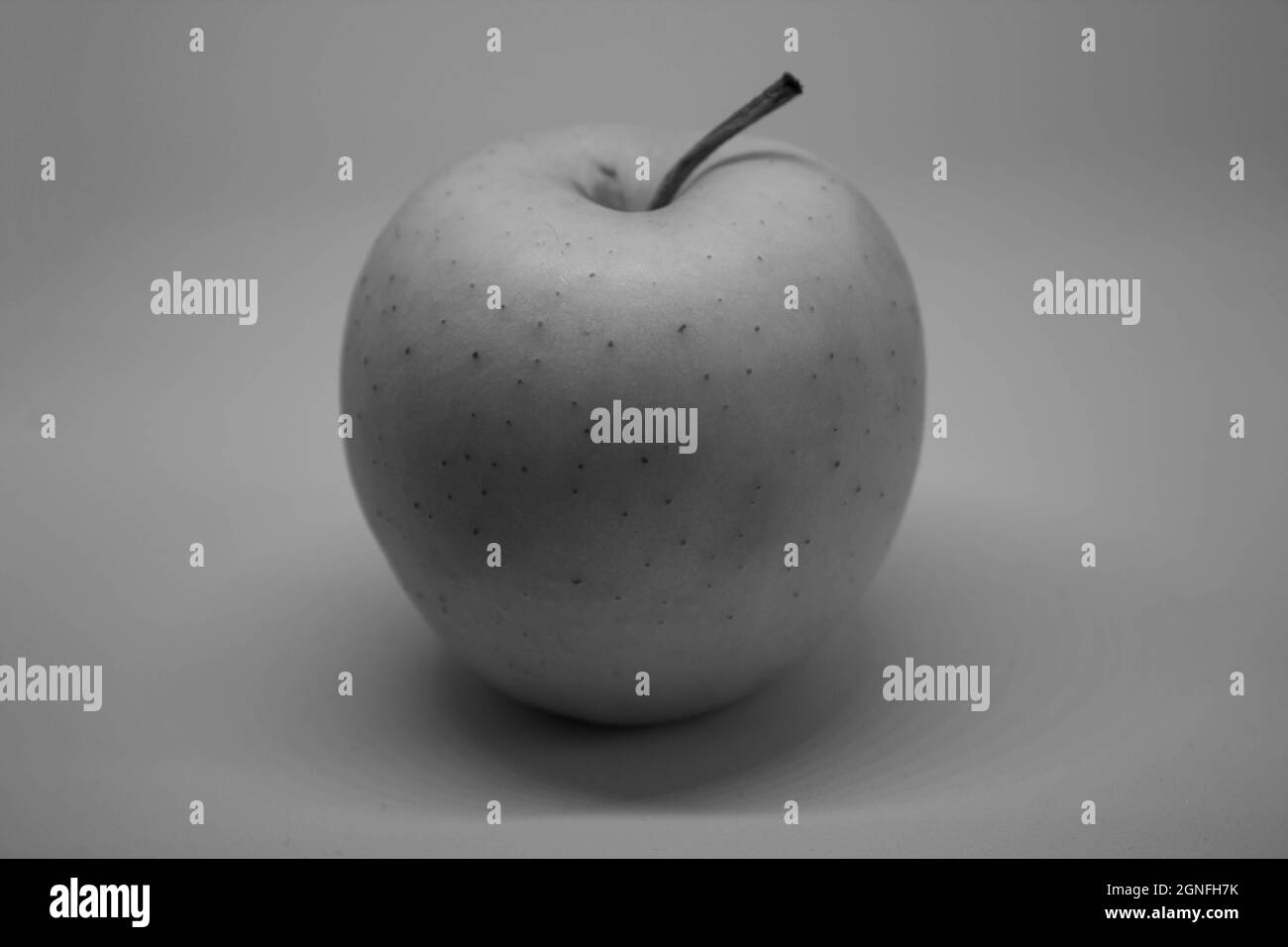 Black and white apple on white background with copy space. Text space Stock Photo