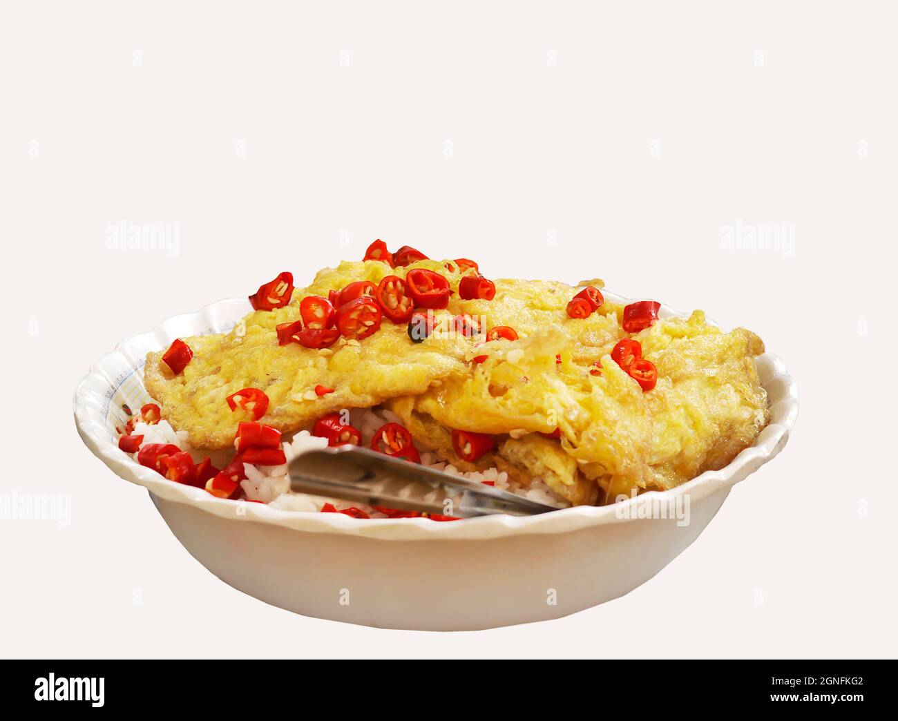 delicious quick meal local thai style deep fried omelette with load of red chilli on rice isolated die cut white background Stock Photo
