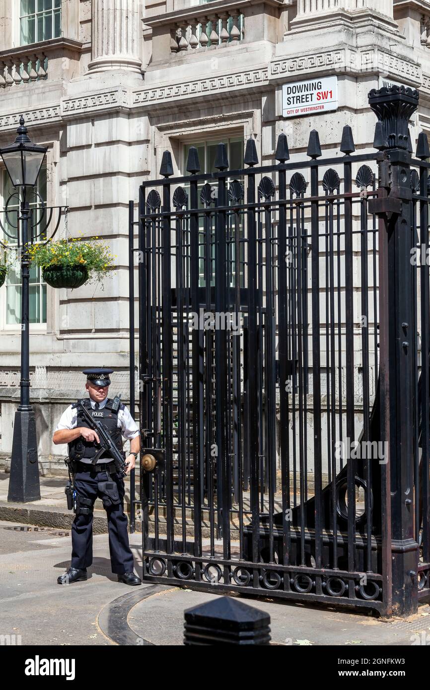 London, UK, July 1, 2012 : Number 10 Downing Street in Whitehall home of the British Prime Minister and government with an armed police officer on dut Stock Photo