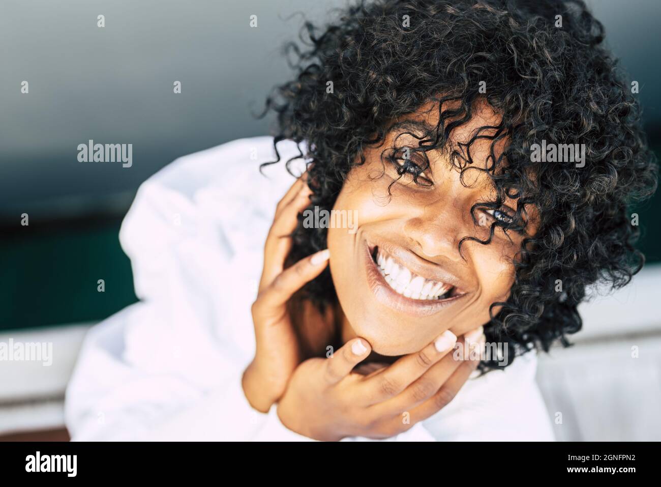 Directly above shot of happy african american woman with curly hair ...