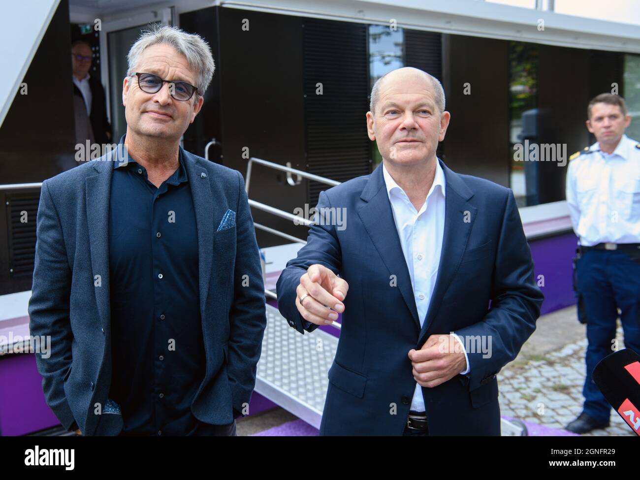 Potsdam, Germany. 25th Sep, 2021. Olaf Scholz (r), Federal Minister of  Finance and top candidate of the SPD for the 2021 federal election, stands  next to journalist Gabor Steingart, media company Media