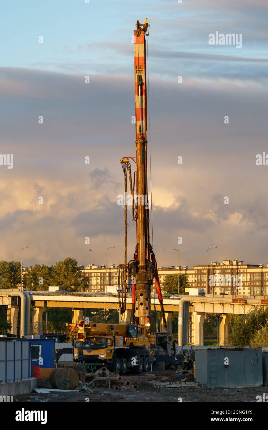 Machine for boring earth at construction site. Vertical tamrock pile foundation drilling machine.  Stock Photo
