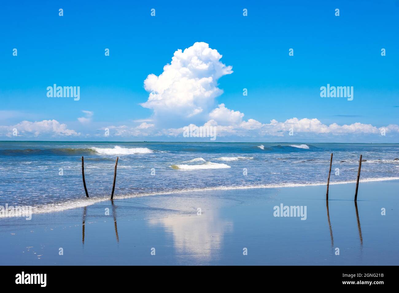 White clouds over the blue sea with sky reflection on the beach Stock ...