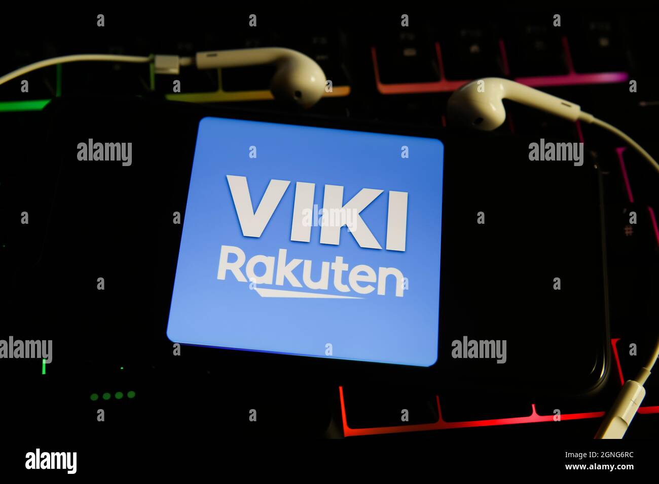 Viersen, Germany - May 9. 2021: View on mobile phone screen with logo lettering of movie streaming service viki rakuten on computer keyboard Stock Photo