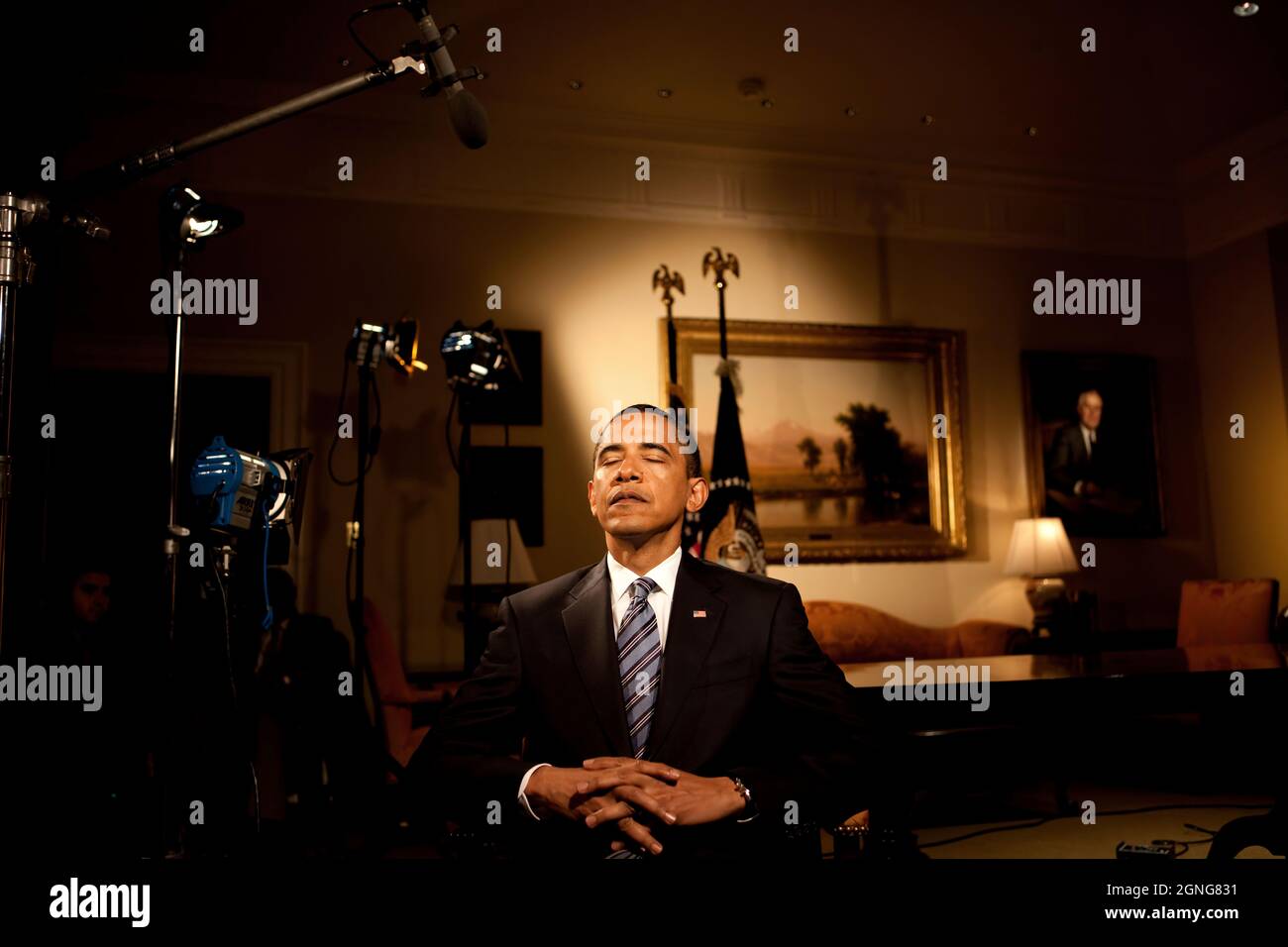 President Barack Obama closes his eyes before he tapes his weekly Radio Address in the Roosevelt Room of the White House, June 2, 2009.  (Official White House Photo by Samantha Appleton) This official White House photograph is being made available for publication by news organizations and/or for personal use printing by the subject(s) of the photograph. The photograph may not be manipulated in any way or used in materials, advertisements, products, or promotions that in any way suggest approval or endorsement of the President, the First Family, or the White House. Stock Photo