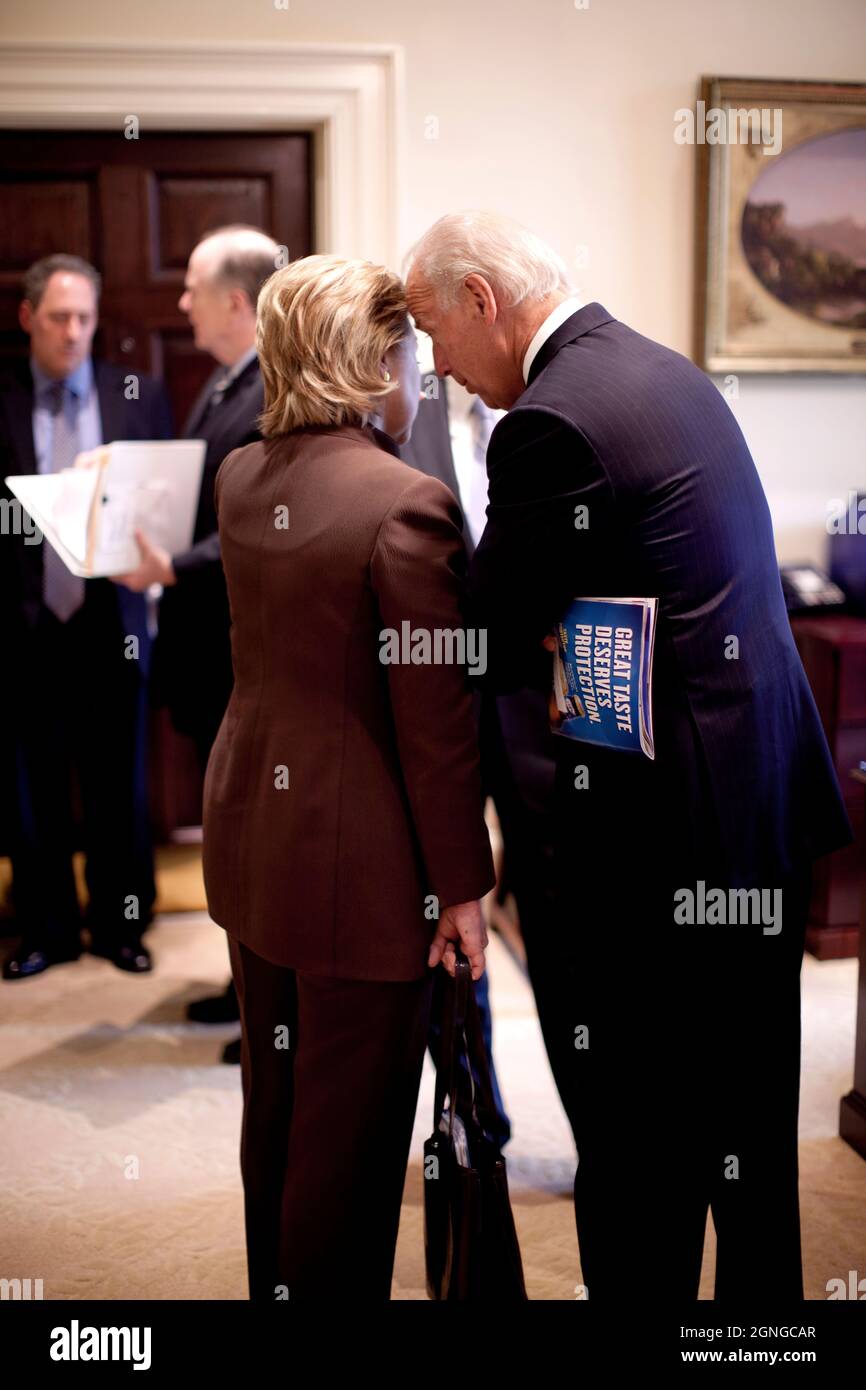 Vice President Joe Biden speaks with Secretary of State Hillary Clinton outside the Oval Office, June 10, 2009.  (Official White House Photo by Pete Souza) This official White House photograph is being made available for publication by news organizations and/or for personal use printing by the subject(s) of the photograph. The photograph may not be manipulated in any way or used in materials, advertisements, products, or promotions that in any way suggest approval or endorsement of the President, the First Family, or the White House. Stock Photo