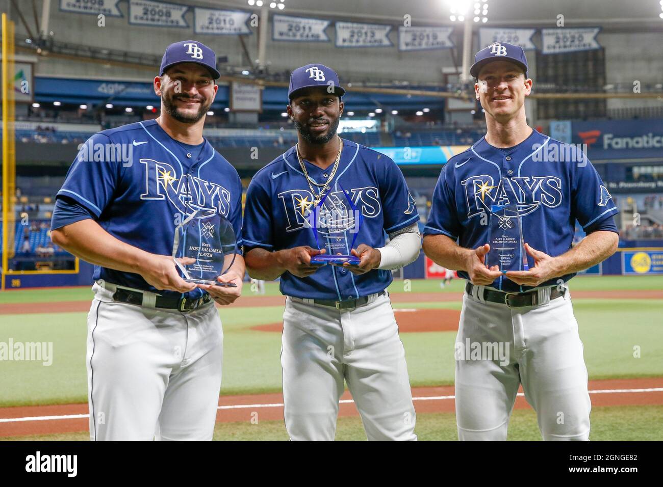 St. Petersburg, USA. 24th Sep, 2021. Tampa Bay Rays catcher Mike Zunino  (10), left, holds his Don Zimmer MVP award along with teammates,  Outstanding Rookie right fielder Randy Arozarena (56), center, and