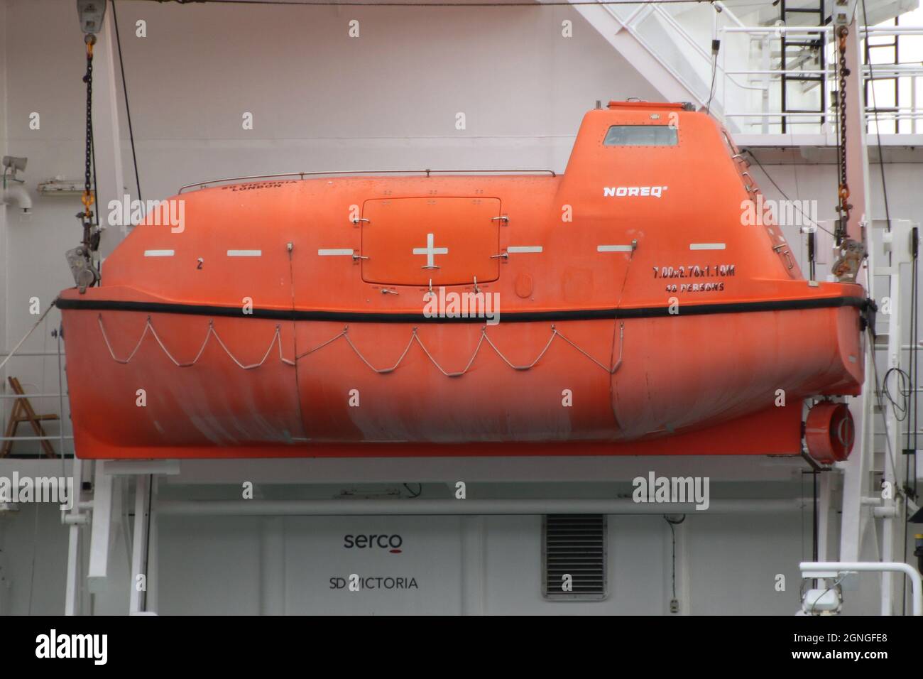 A 48-person Noreq lifeboat, carried aboard SD Victoria, a worldwide support vessel operated by Serco Marine Services on behalf of the UK military. The ship was passing Greenock on the Firth of Clyde, as she headed out to take part in the military exercises Dynamic Mariner 2021 and Joint Warrior 21-2. Stock Photo