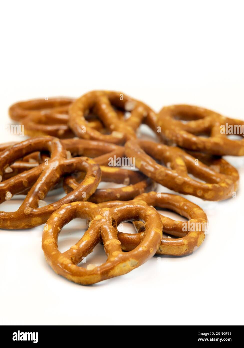 Salted mini pretzel snacks isolated on white background Stock Photo