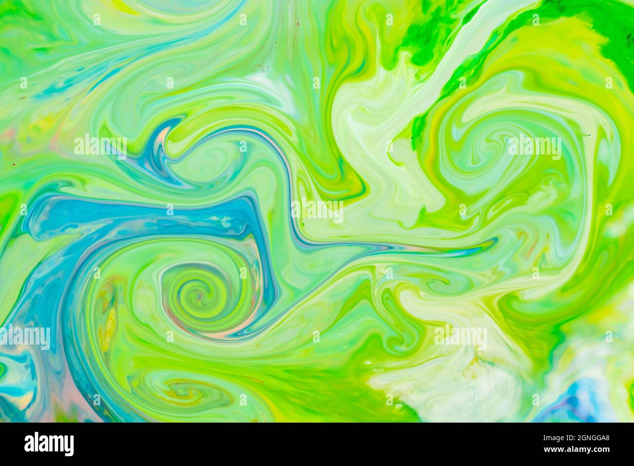 Green fluid art background. Liquid abstract pattern with UFO green. Marble texture of liquid surface. Fluid art Stock Photo