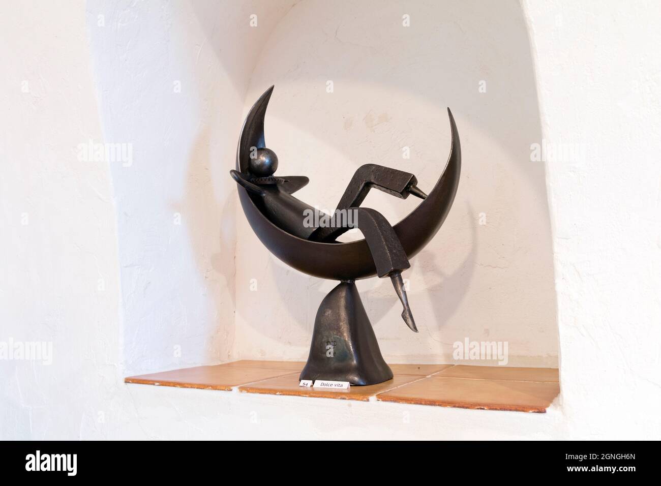 Dolce vita statue. Old tools and iron pieces are an inspiration to sculptor Jean-Pierre Augier, who gathers and turns them into characters on the move Stock Photo