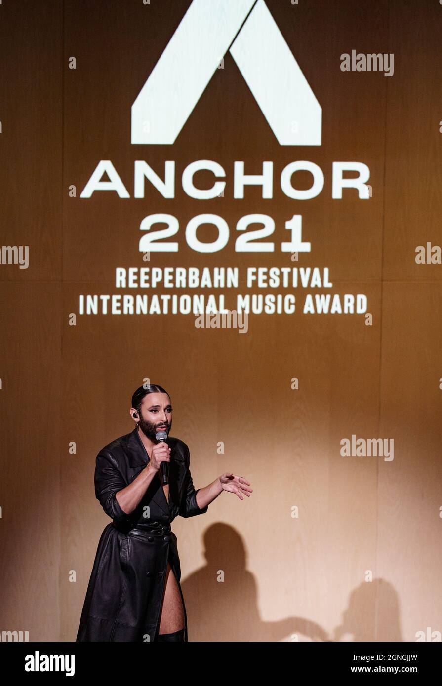 Hamburg, Germany. 25th Sep, 2021. Conchita Wurst, presenter of the Anchor  Award, stands on stage at the St. Pauli Theater during the award ceremony  at the Reeperbahn Festival. The Reeperbahn Festival is
