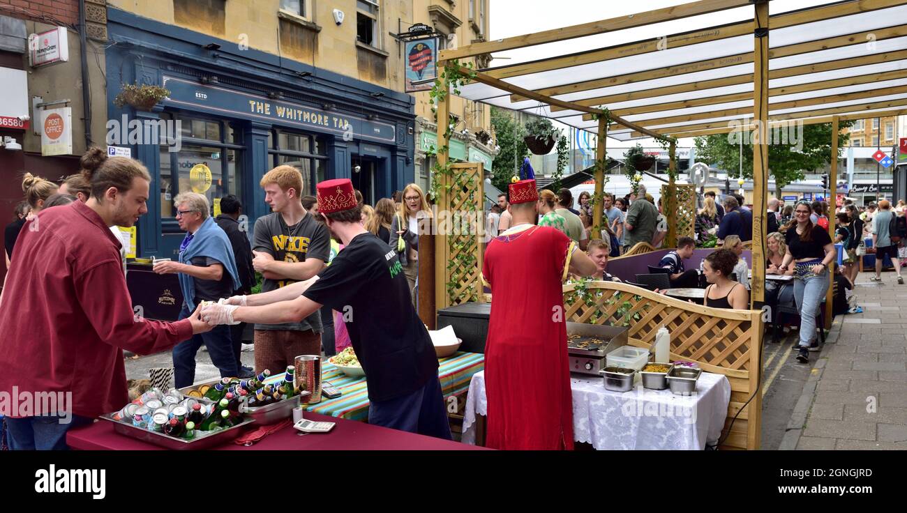 Summer street party, road pedestrianized with cafes, restaurants and