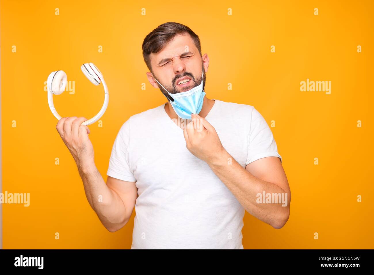 Listen music mask young man hi-res stock photography and images - Alamy