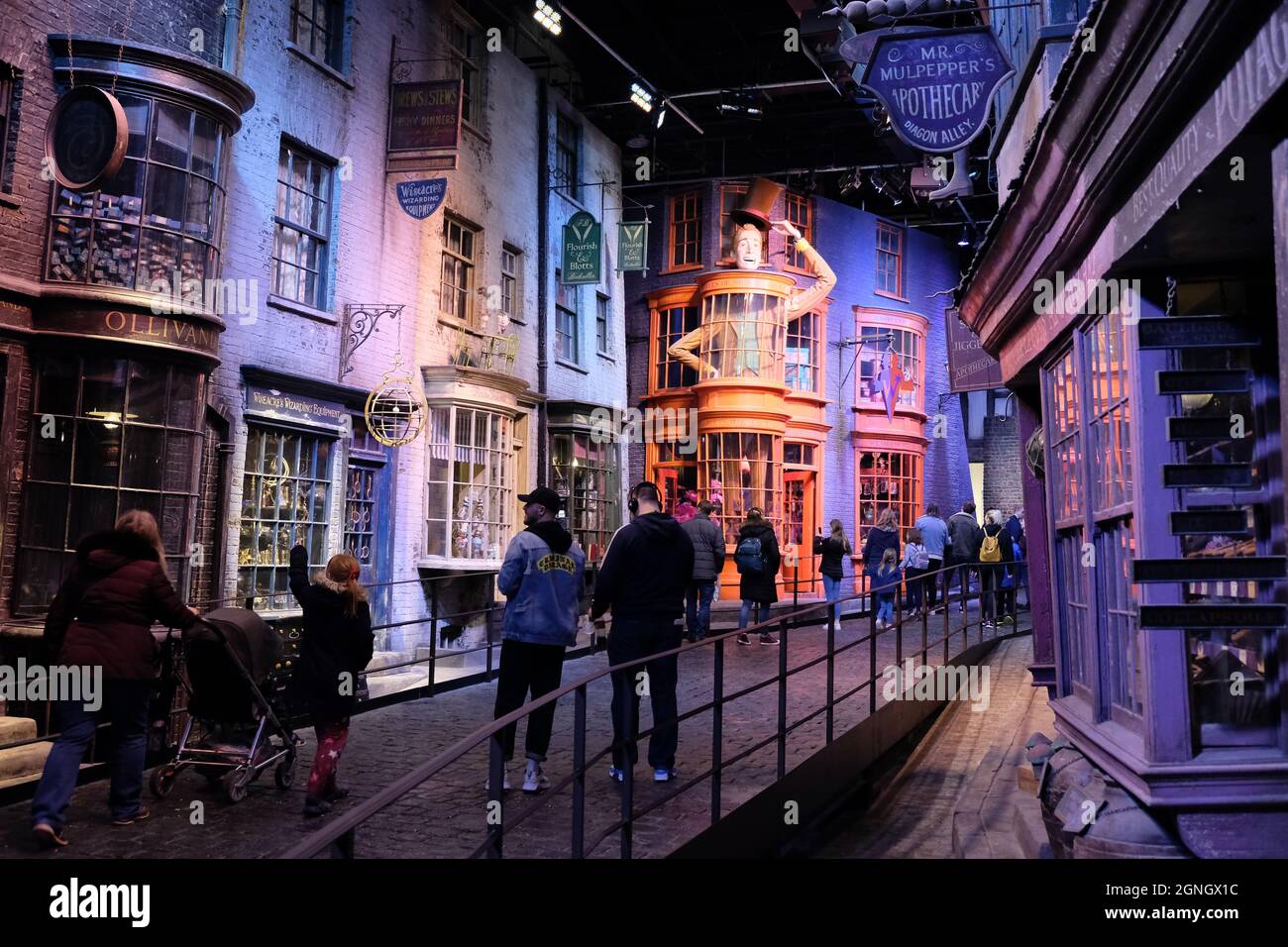 Leavesden, UK: Visitors walk along Diagon Alley, a studio replica of the famous street from the Harry Potter films Stock Photo