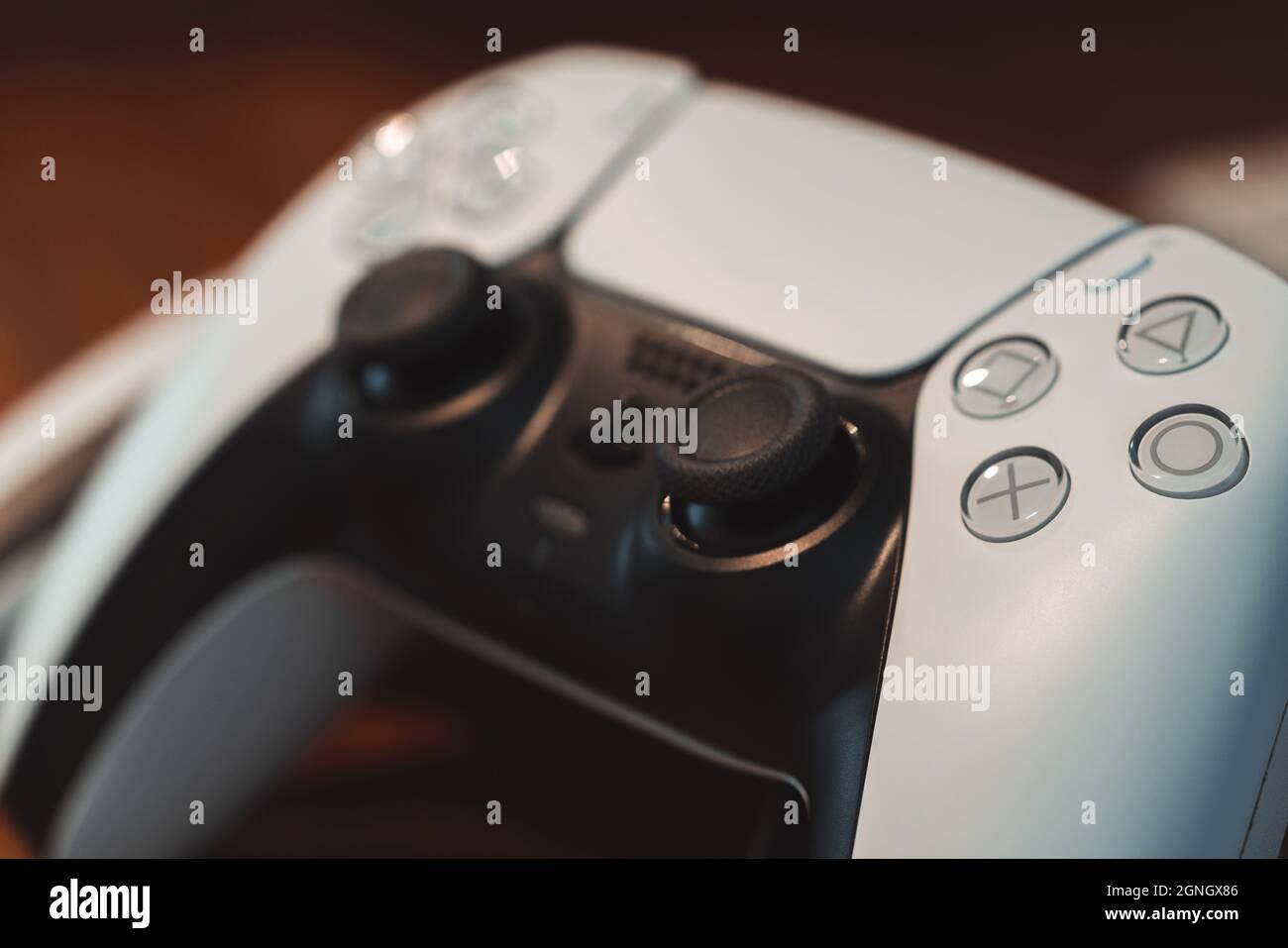 London, UK - May 25, 2021: Close up of white Playstation 5 (PS5) DualSense wireless controller. Playstation 5 is the latest video game console from So Stock Photo